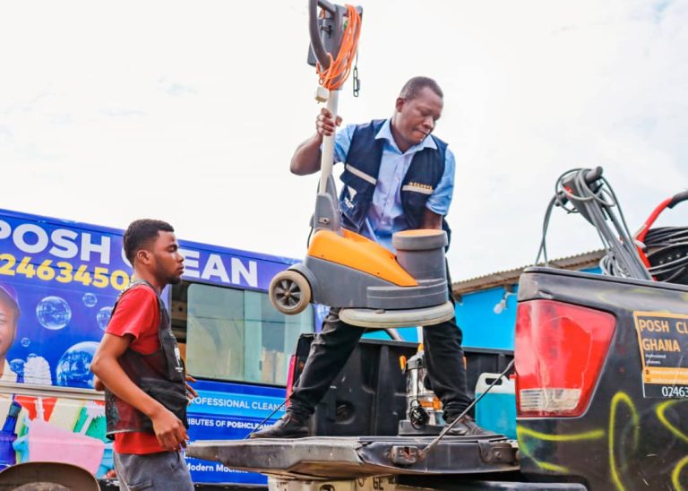 Posh Clean Services team loading cleaning equipment onto the branded company truck in Accra