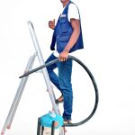Posh Clean Services team member with professional cleaning equipment
